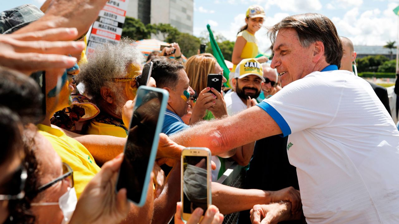 Brazilian President Jair Bolsonaro greets supporters at a pro-government demonstration.
