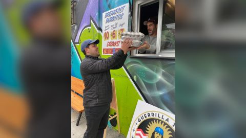 A customer picks up his Emergency Taco Kit.