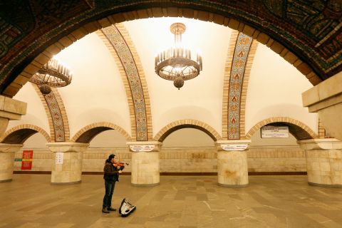 A musician plays the violin on March 17 at a train station in Kiev, Ukraine.