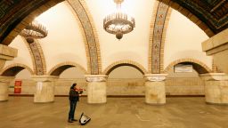 A musician plays violin as he waits for the last train before metro shutdown amid coronavirus (COVID-19) concerns, at Zoloti Vorota station in central Kiev, Ukraine March 17, 2020.  REUTERS/Valentyn Ogirenko     TPX IMAGES OF THE DAY