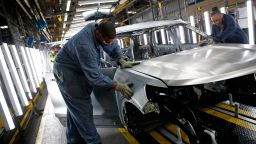 Workers assemble cars at the newly renovated Ford's Assembly Plant in Chicago, June 24, 2019. - The plant was revamped to build the Ford Explorer, Police Interceptor Utility and Lincoln Aviator. 