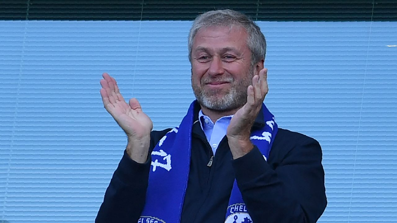 Roman Abramovich applauds as Chelsea players celebrate their league title win at Stamford Bridge in London on May 21, 2017.