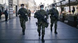 TOPSHOT - Serbian army soldiers wearing gloves and face masks as preventive measures against COVID-19 (novel Coronavirus), patrol on one of the main pedestrian streets in Belgrade on March 17, 2020. - Serbia declared a state of emergency on March 15, 2020 to halt the spreading of the new coronavirus, shutting down many public spaces, deploying soldiers to guard hospitals and closing the borders to foreigners. Serbia's President Aleksandar Vucic said the new restrictions were necessary to "save our elderly" in the Balkan state of some seven million, which has detected around 72 infections of COVID-19 so far with limited testing. (Photo by Vladimir Zivojinovic / AFP) (Photo by VLADIMIR ZIVOJINOVIC/AFP via Getty Images)