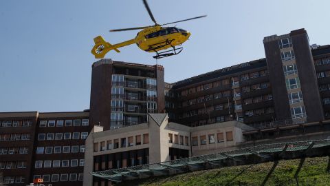 A medical emergency helicopter takes off from Brescia hospital in Italy. Experts say it is too early to say if cases are leveling off.