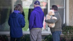 KIRKLAND,  - MARCH 14: Family members speak to a resident of the Life Care Center on March 14, 2020 in Kirkland, Washington. The nursing home has had the highest number of coronavirus deaths of any location in the United States.  (Photo by John Moore/Getty Images)