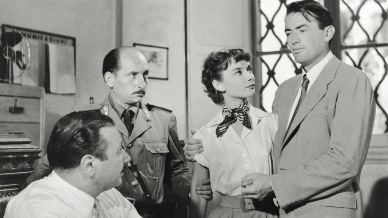 <strong>"Roman Holiday": </strong>Equal parts bittersweet and enchanting, the 1953 fairy tale features a doe-eyed princess (Audrey Hepburn) and a dashing newspaperman (Gregory Peck, far right) in a romantic caper in Rome.