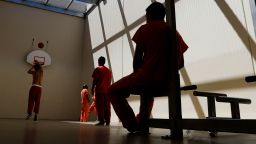 FILE - In this Aug. 28, 2019, file photo, detainees exercise at the Adelanto ICE Processing Center in Adelanto, Calif. The Trump administration has awarded four contracts worth billions of dollars to operate private immigration detention centers in California, less than two weeks before a new state law forbidding them takes effect. (AP Photo/Chris Carlson, File)