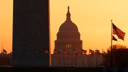 The Washington Monument and the U.S. Capitol are seen in Washington, at sunrise Wednesday, March 18, 2020. The White House has sent Congress an emergency $46 billion spending request for coronavirus-related funding this year. (AP Photo/Carolyn Kaster)