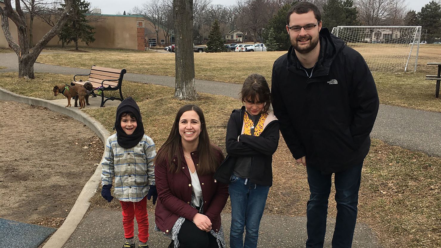 Whitney Johnson and Jackson Groonwald, two student volunteers with MN CovidSitters, with the children of a general surgery resident who needed assistance amid the coronavirus pandemic. 
