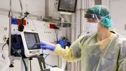 This picture taken on March 16, 2020 during a press presentation of the hospitalisation service for future patients with coronavirus at Samson Assuta Ashdod University Hospital in the southern Israeli city of Ashdod, shows the director of the epidemics service Dr Karina Glick checking a medical ventilator control panel at a ward, while wearing protective clothing. - As of March 16, Israel has 255 confirmed cases of coronavirus with no fatalities but tens of thousands in home-quarantine. Authorities have banned gatherings of more than 10 people and ordered schools, universities, restaurants and cafes to close, among other measures. (Photo by JACK GUEZ / AFP) (Photo by JACK GUEZ/AFP via Getty Images)