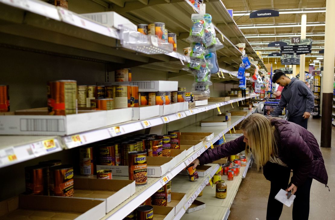 Shoppers are stocking up on canned foods and other shelf-stable products. (Jeremy Hogan/Echoes Wire/Barcroft Media/Getty Images)