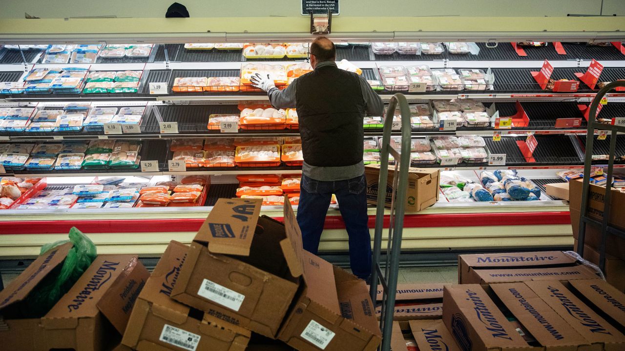 A worker restocks the meat section of a Stop & Shop supermarket in North Providence, Rhode Island. (David Goldman/AP)