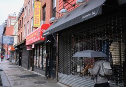 Closed store fronts on March 17, 2020 in the Brooklyn Borough of New York City. - The coronavirus outbreak has transformed the US virtually overnight from a place of boundless consumerism to one suddenly constrained by nesting and social distancing.The crisis tests all retailers, leading to temporary store closures at companies like Apple and Nike, manic buying of food staples at supermarkets and big-box stores like Walmart even as many stores remain open for business -- albeit in a weirdly anemic consumer environment.