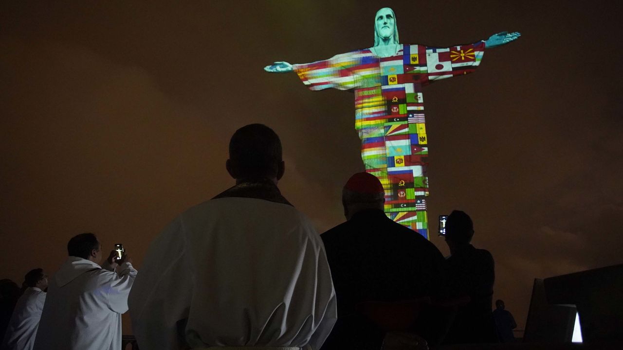 The Christ the Redeemer statue was illuminated during a special mass for people suffering during the coronavirus pandemic.