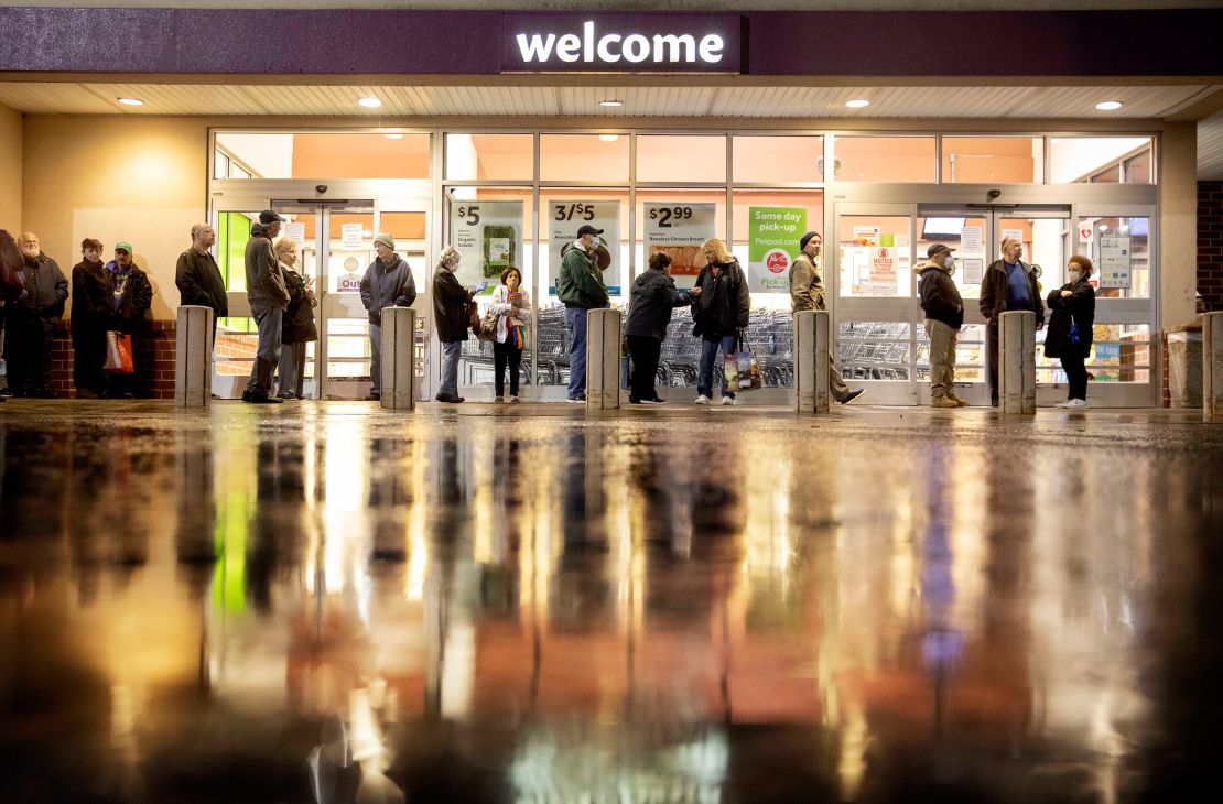 Shoppers wait in line to enter a Stop & Shop supermarket in North Providence, RI