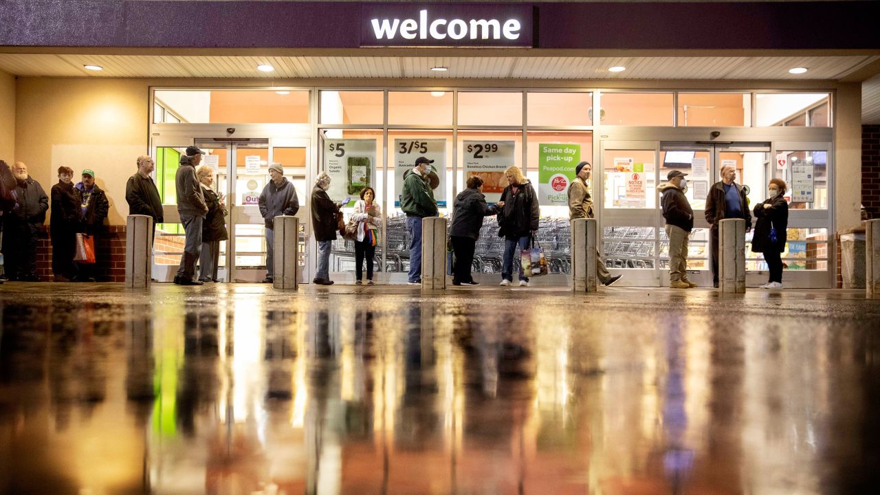 Shoppers wait in line to enter a Stop & Shop supermarket in North Providence, RI