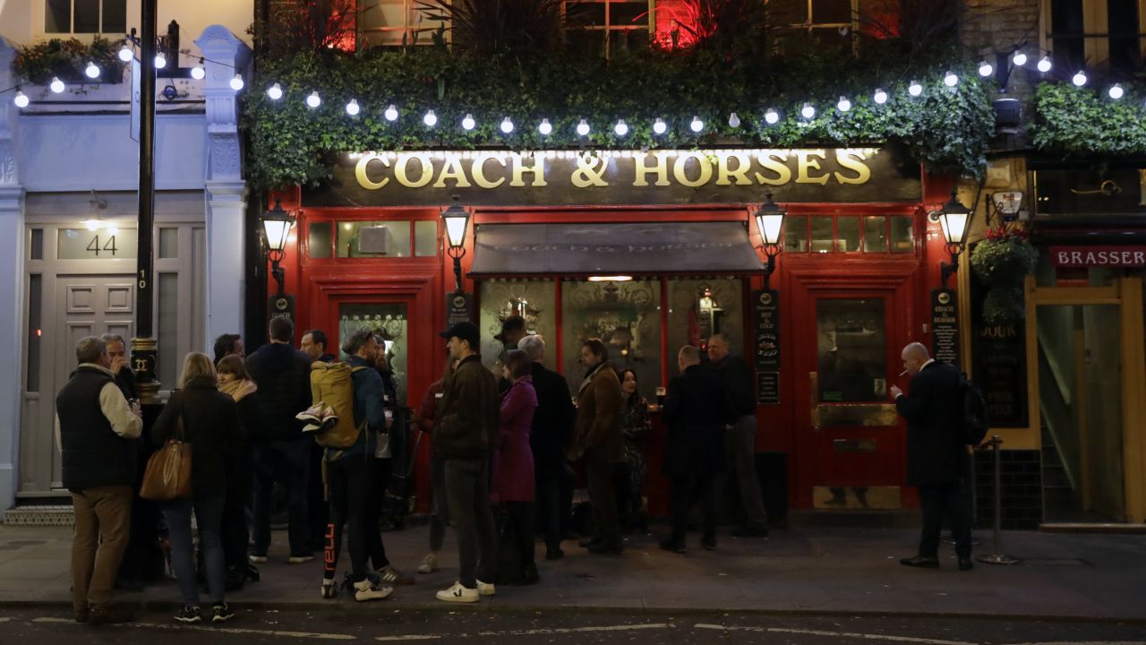 Crowds still gather in London, here at a pub in Covent Garden, a popular tourist area. 