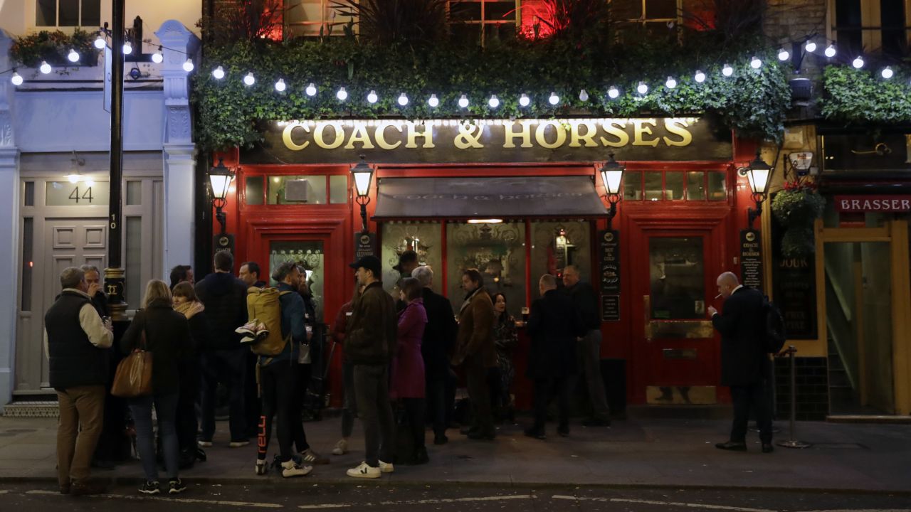 Crowds still gather in London, here at a pub in Covent Garden, a popular tourist area.