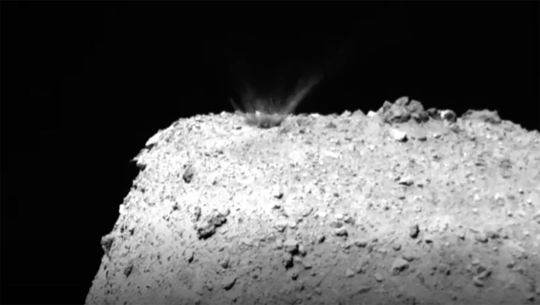 This still from a video created by images captured by Hayabusa 2 shows material being ejected and falling back onto the asteroid after impact. 