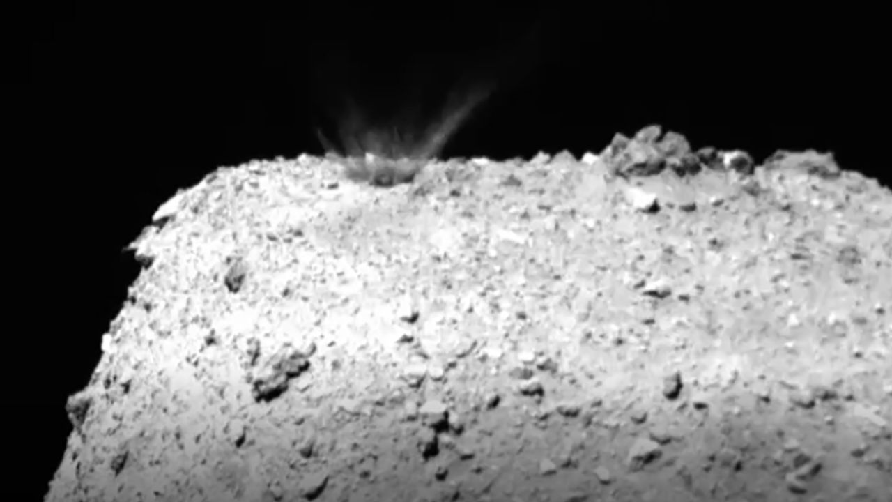 This still from a video created by images captured by Hayabusa 2 shows material being ejected and falling back onto the asteroid after impact.