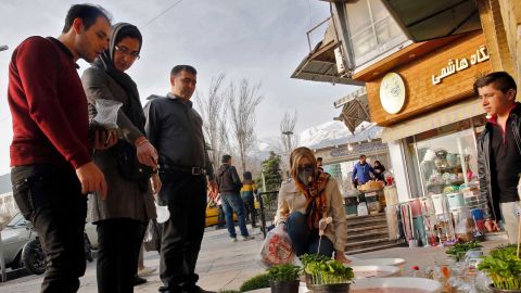 People view items for sale ahead of Nowruz outside the Tajrish Bazaar in Iran's capital Tehran on March 12, 2020.