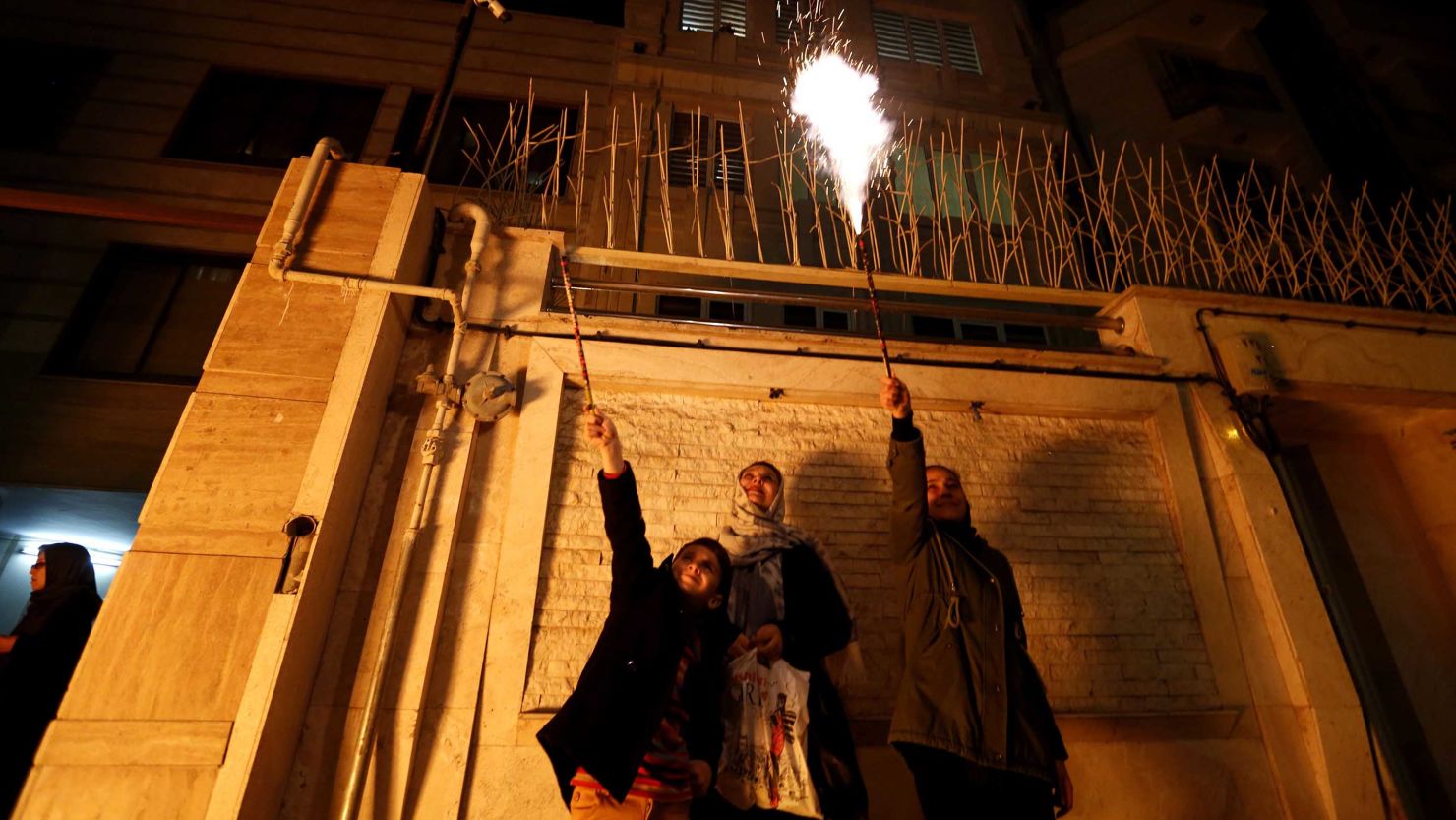 Iranian families light firecrackers outside their homes in Tehran on March 13, 2018 during Chaharshanbe Soori, held annually on the last Wednesday evening before Nowruz.