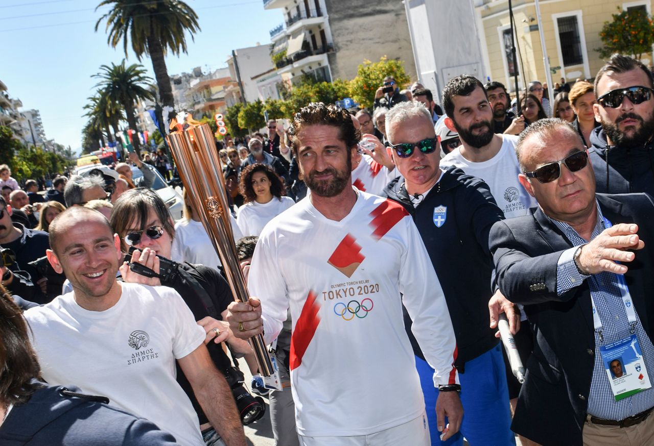 Actor Gerard Butler holds the torch during the Olympic flame relay in Sparta, Greece, on Friday, March 13. Butler played Sparta's King Leonidas in the movie "300."