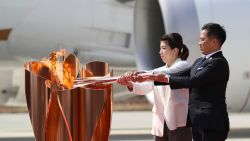 The Olympic Flame Arrival Ceremony for 2020 Tokyo Olympic Games is held at JASDF Matsushima Airbase in Higashimatsushima City, Miyagi Prefecture on March 20, 2020. Although Japanese former Judo Olympian Tadahiro Nomura and former Wrestling Olympian Saori Yoshida could not attend the torch relay at Panathinaiko Stadium in Greece due to avoid the outbreak of the new coronavirus COVID-19, they received the torch carried from Greece. ( The Yomiuri Shimbun via AP Images )