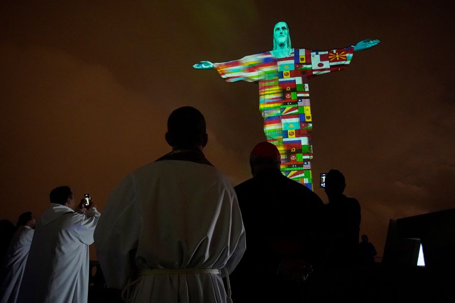 A Mass in Rio de Janeiro honors coronavirus victims around the world on March 18, 2020. Brazil's Christ the Redeemer statue <a href="https://www.cnn.com/travel/article/coronavirus-rio-christ-the-redeemer-trnd/index.html" target="_blank">was lit up with flags and messages of hope</a> in solidarity with countries affected by the pandemic.