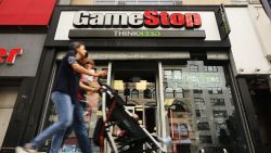 People pass a GameStop store in lower Manhattan on September 16, 2019 in New York City.