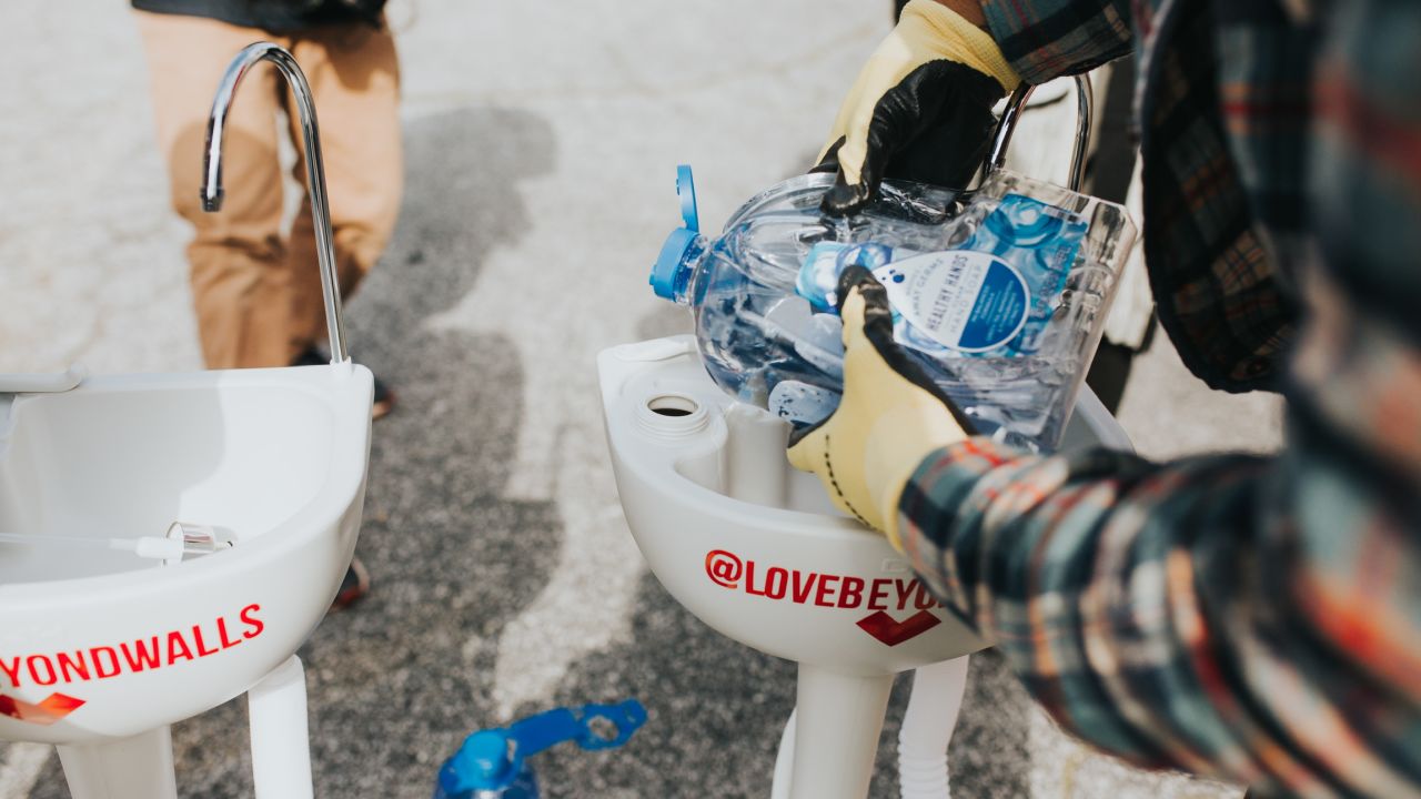 The Love Beyond Walls nonprofit cleans each portable sink daily. It also refills the water and soap containers and makes any necessary repairs.
