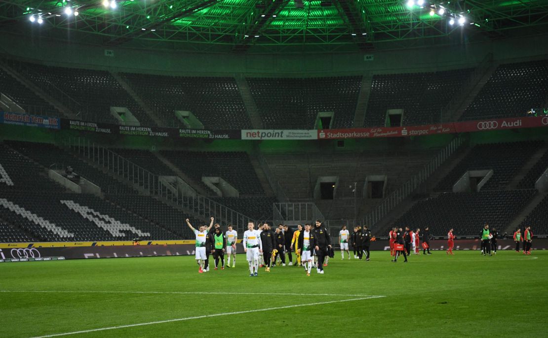 Borussia Monchengladbach celebrate after a game played behind closed doors due to the coronavirus pandemic. The league has since been suspended altogether.