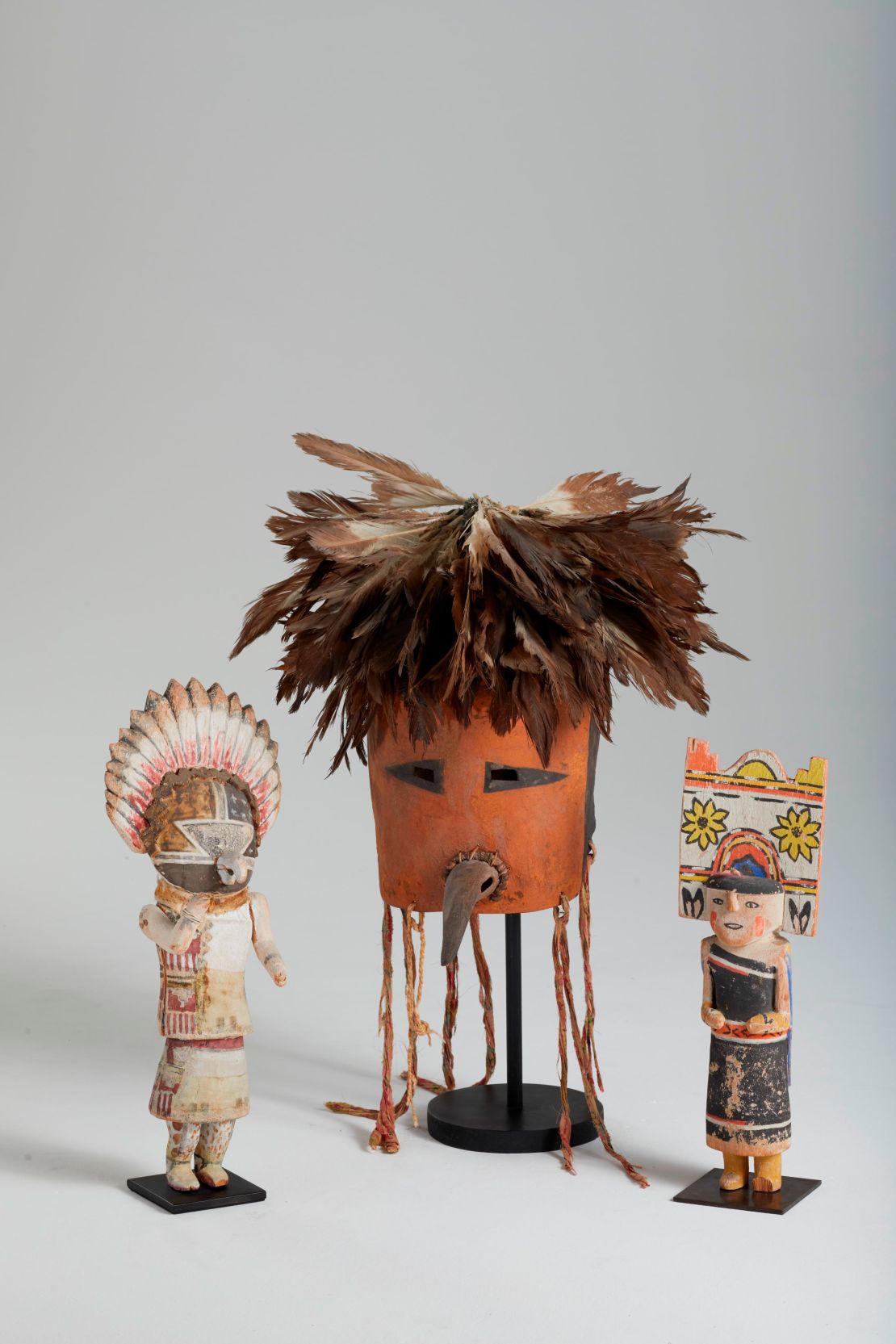 Hopi mask and kachina dolls, late 19th to early 20th century. Eastern cottonwood, leather, pigments, wool, and feathers, private collection