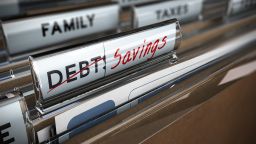 underscored folders marked debt and savings