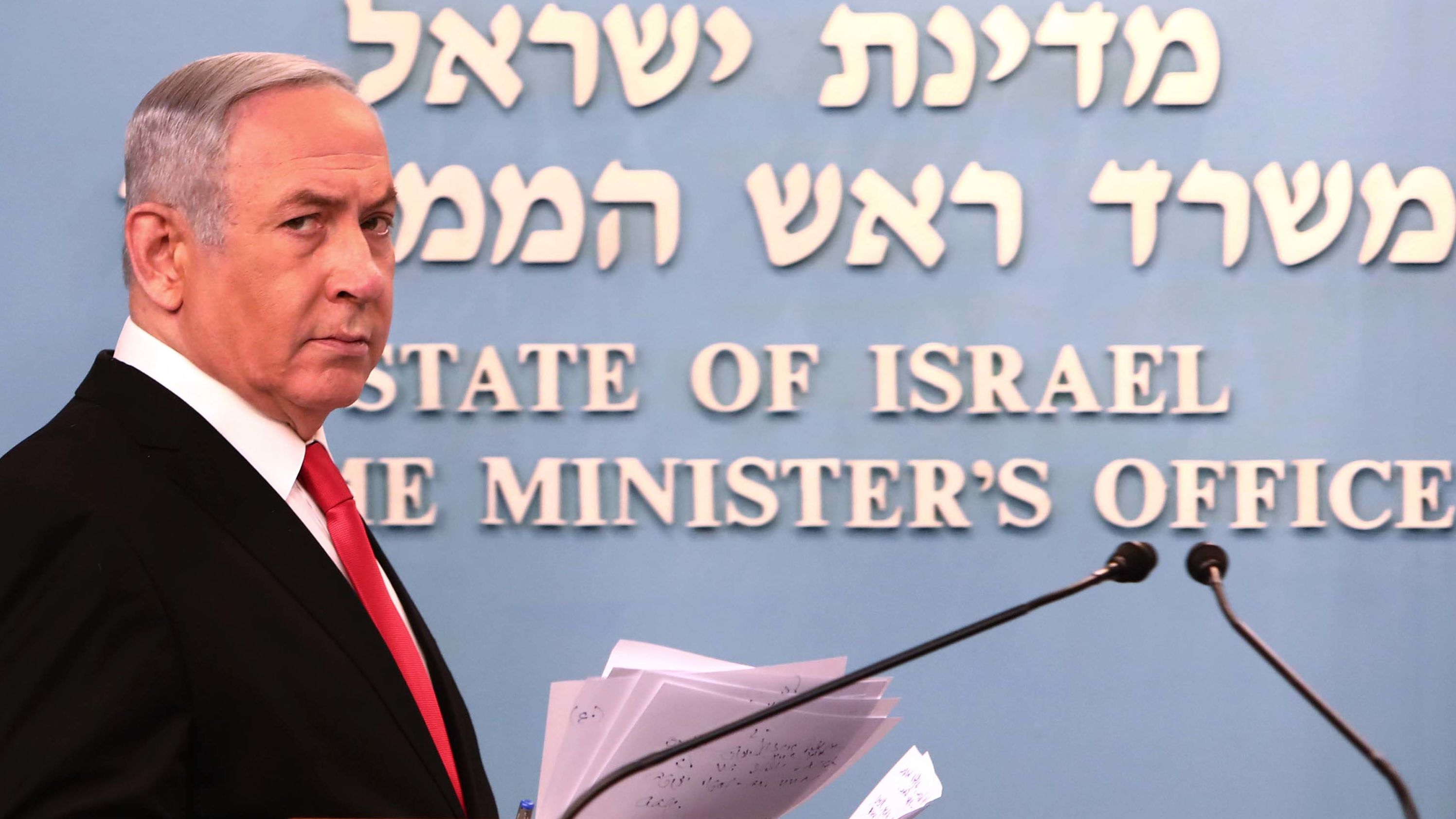 Israeli Prime Minister Benjamin Netanyahu arrives for a speech at his Jerusalem office on March 14, 2020, regarding the new measures that will be taken to fight the Corona virus in Israel. 