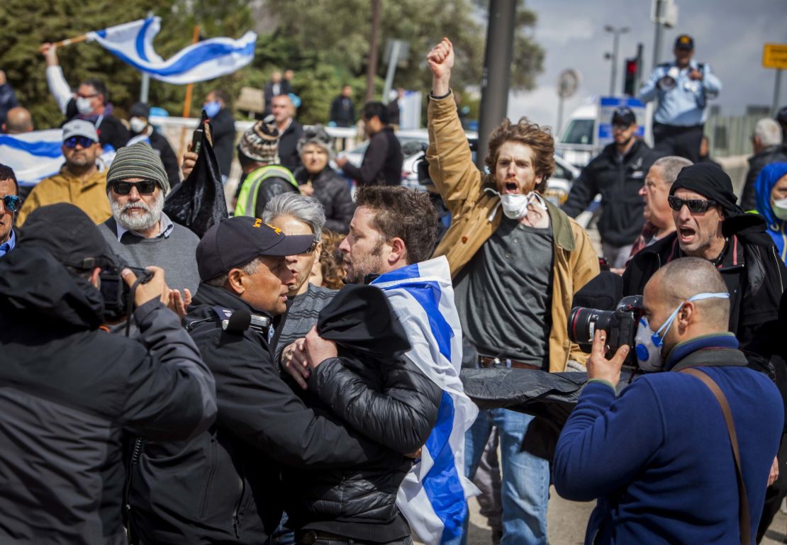 Protesters gathered outside the Knesset Thursday.
