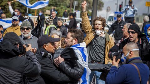 Protesters gathered outside the Knesset Thursday.