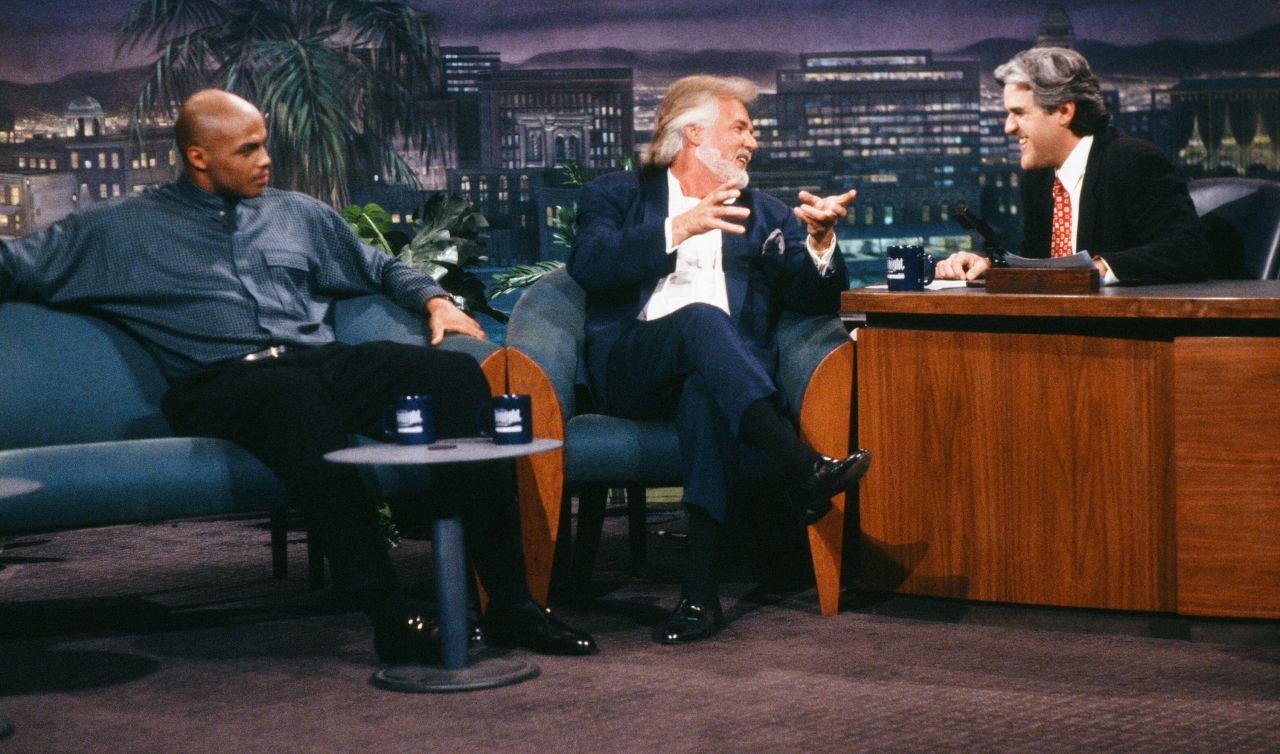 Rogers talks with "Tonight Show" host Jay Leno in 1994 as Charles Barkley looks on.