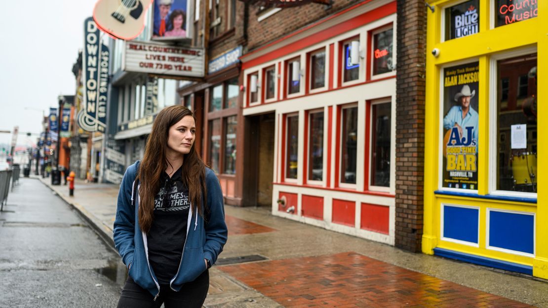 Carolyn Lethgo stands outside AJ's Good Time Bar, owned by singer Alan Jackson.