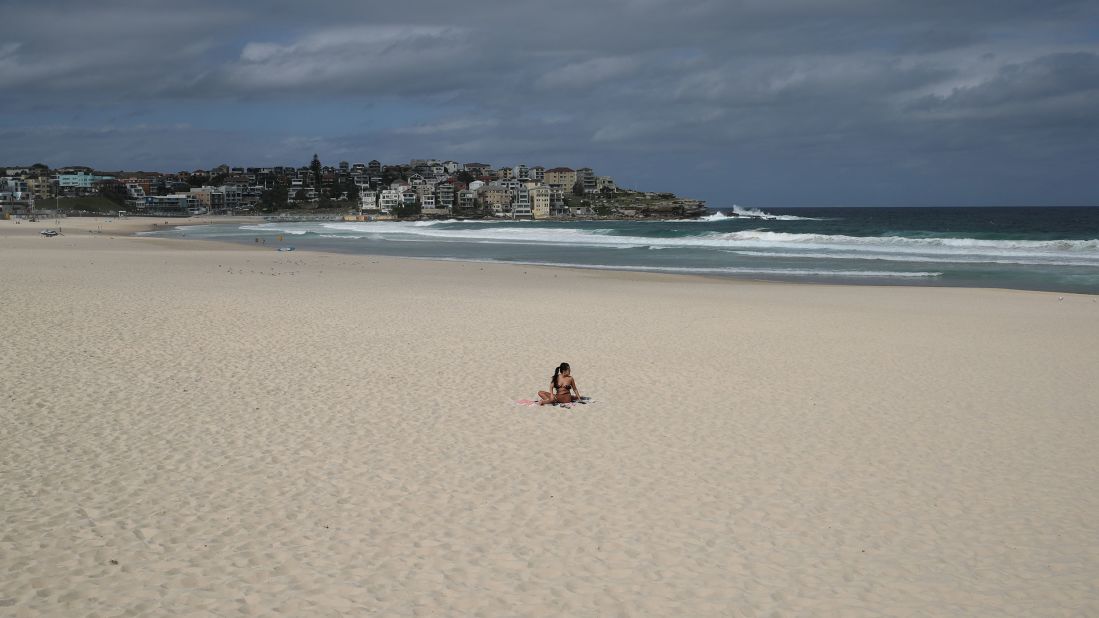 A single sunbather remains following the closure of Sydney's Bondi Beach on March 21.