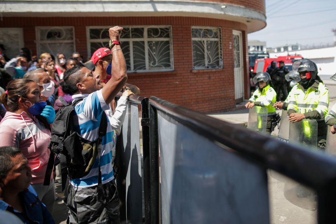 Relatives of inmates gather outside La Modelo jail in Bogota, Colombia, Sunday, March 22, 2020. 