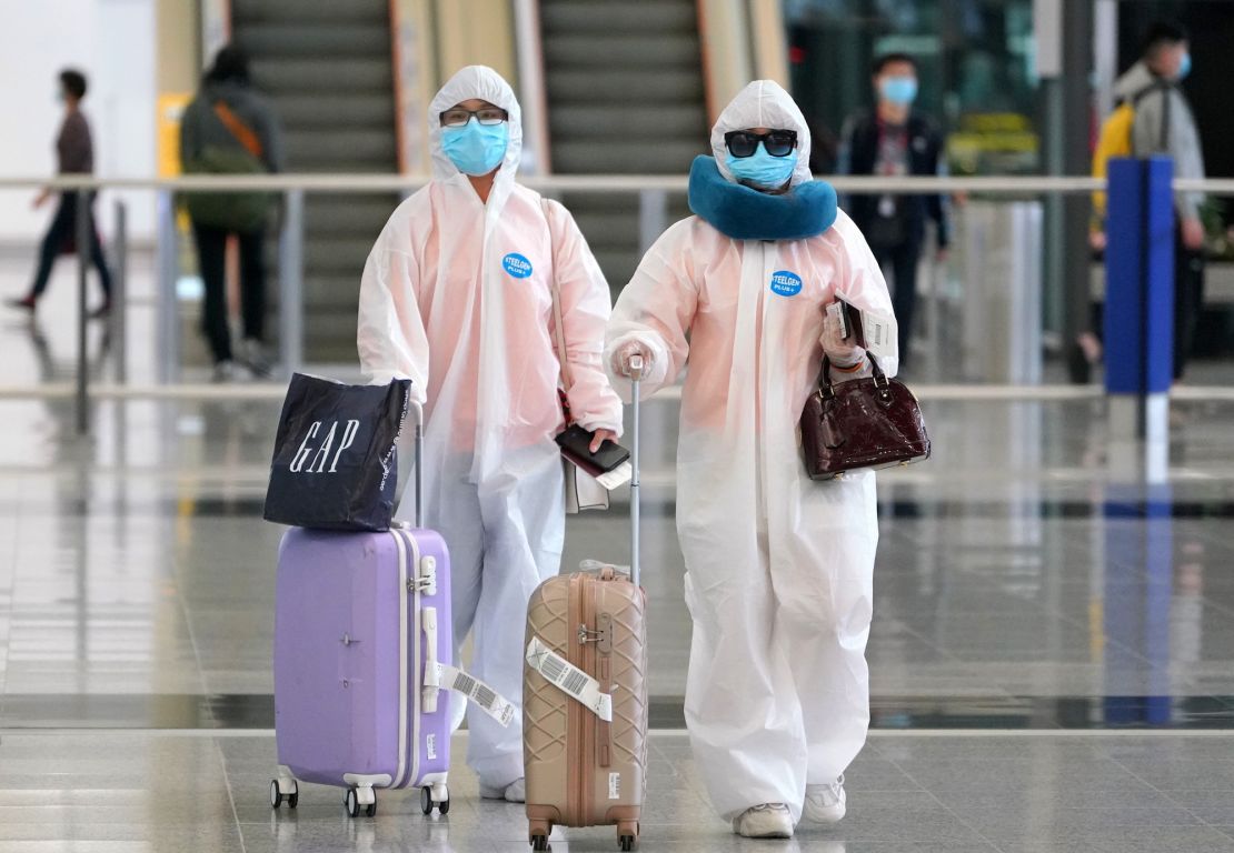 Arrivals at Hong Kong airport on March 18 seen wearing heavy protective gear against the novel coronavirus.