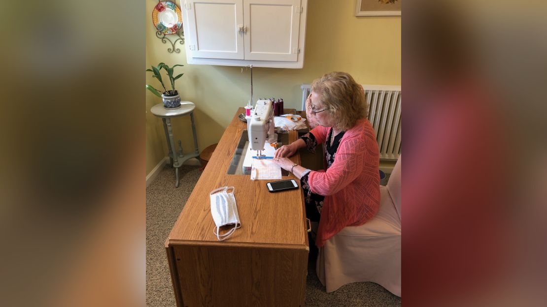 Sheri Yeisely crafts a homemade mask for hospitals in Bethlehem, Pennsylvania, using fabric and her sewing machine.