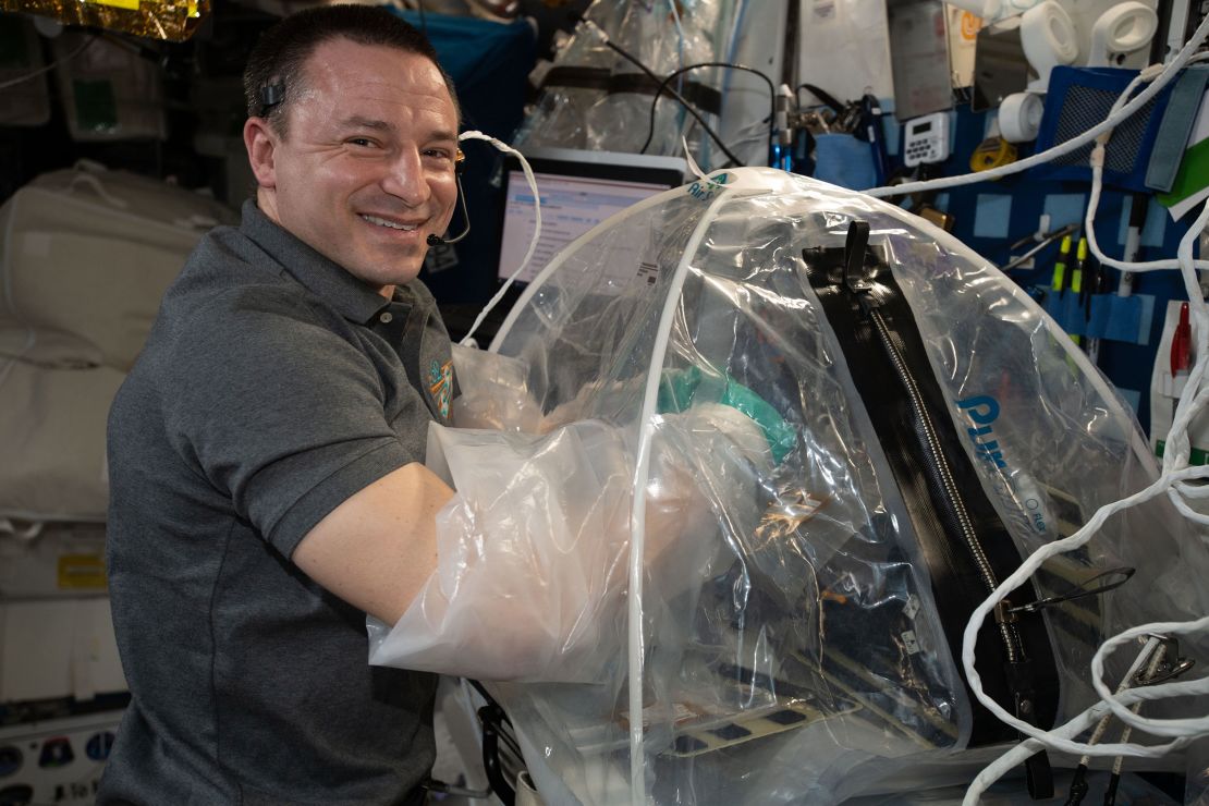 Morgan conducts cardiac research activities inside the portable glovebag. 