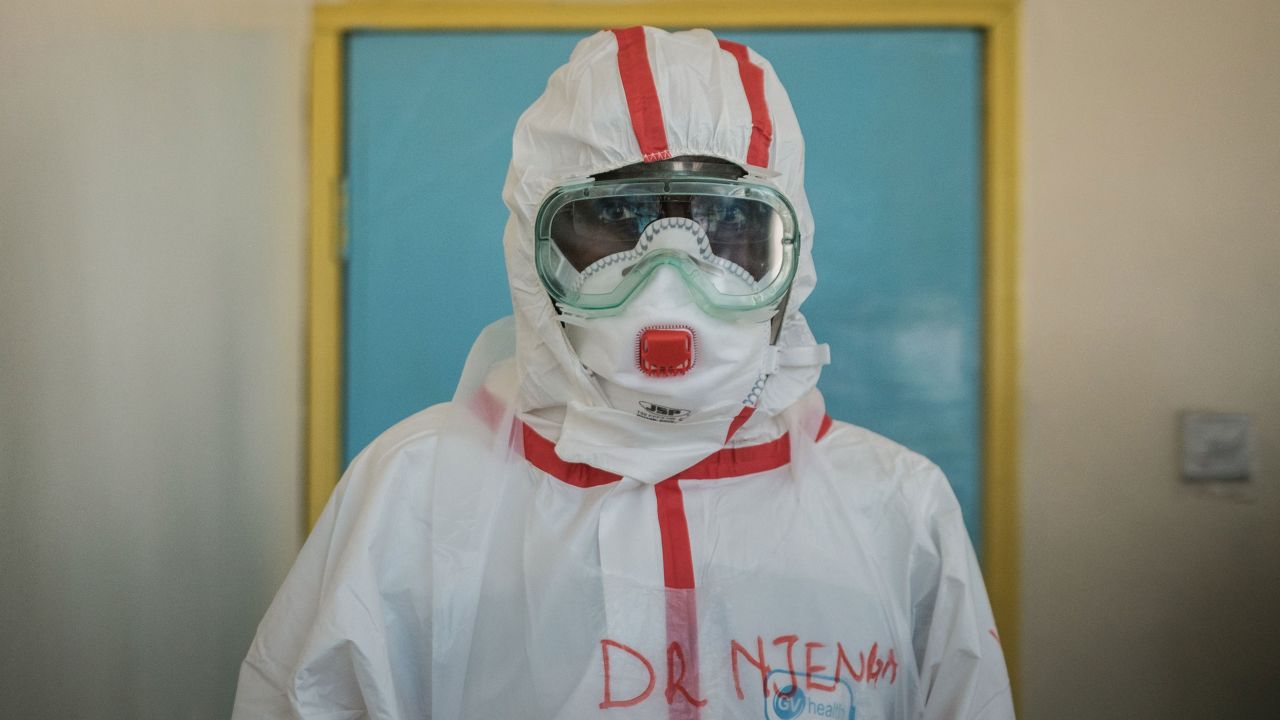 A doctor gets ready with protective gears before visiting the ward for quarantined people who had close contacts with the first Kenyan patient of the COVID-19 at the Infectious Disease Unit of Kenyatta National Hospital in Nairobi, Kenya, 