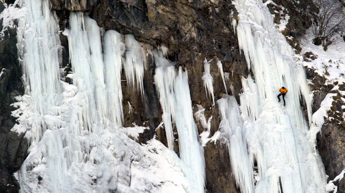 A climber abseils a frozen waterfall in France's Cirque de Gavarnie in the Pyranees.