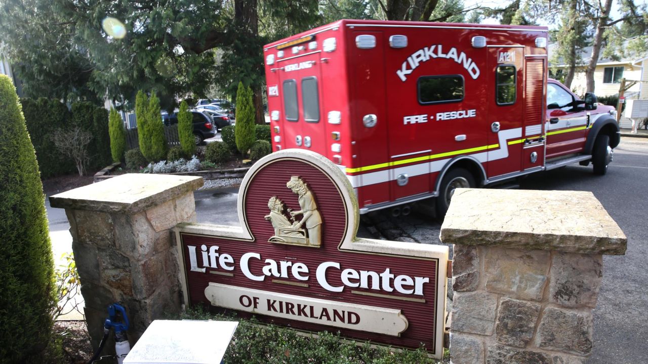 An ambulance leaves the Life Care Center in Kirkland, Washington. 
