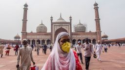 A Indian Muslim woman wears a protective mask as she leaves Friday prayers at the historic Jama Masjid on March 20, 2020 in Delhi, India. 