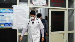 Doctors are seen in front of an insloation ward for COVID-19 coronavirus, at Guru Nanak Dev hospital in Amritsar on March 7, 2020. - The World Health Organization called the spread of the virus "deeply concerning" as a wave of countries reported their first cases of the disease -- which has now killed nearly 3,500 people and infected more than 100,000 across 92 nations and territories.