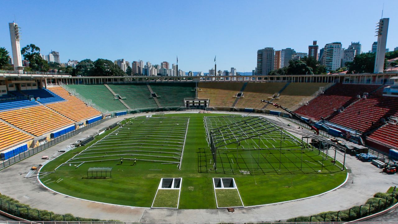 Workers set up an emergency specific makeshift hospital in the Pacaembu Stadium for Coronavirus patients.